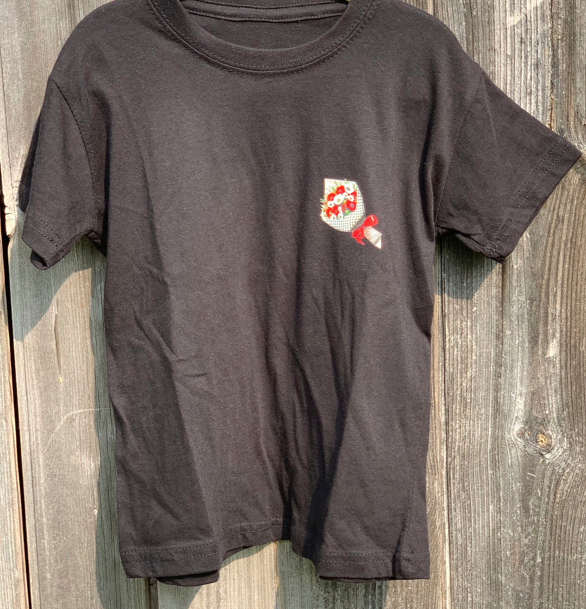 Kids T-shirt with olives and poppies wrapped in keffiyeh print on chest