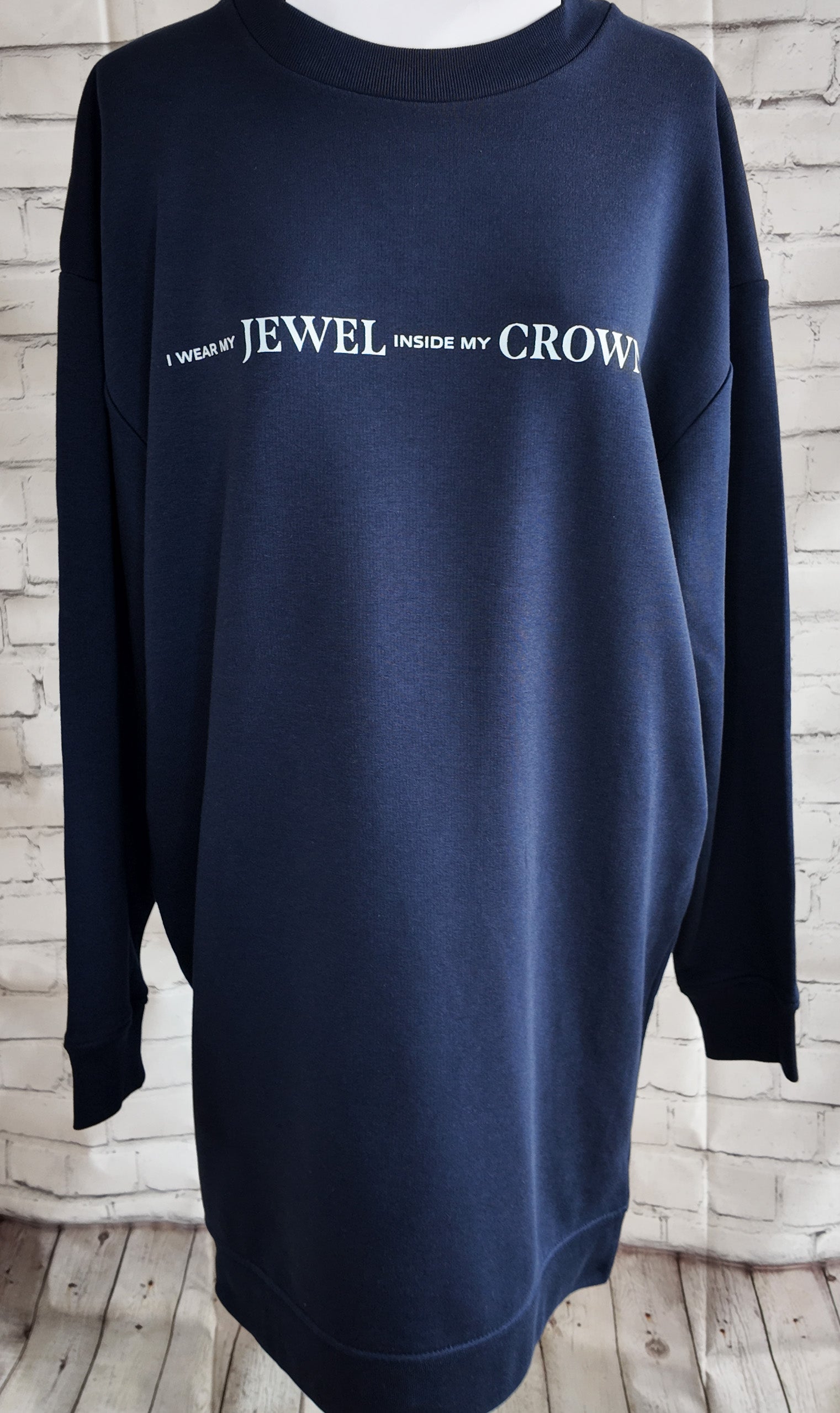 Product photo of the navy "I wear my jewel inside my crown" top, front view