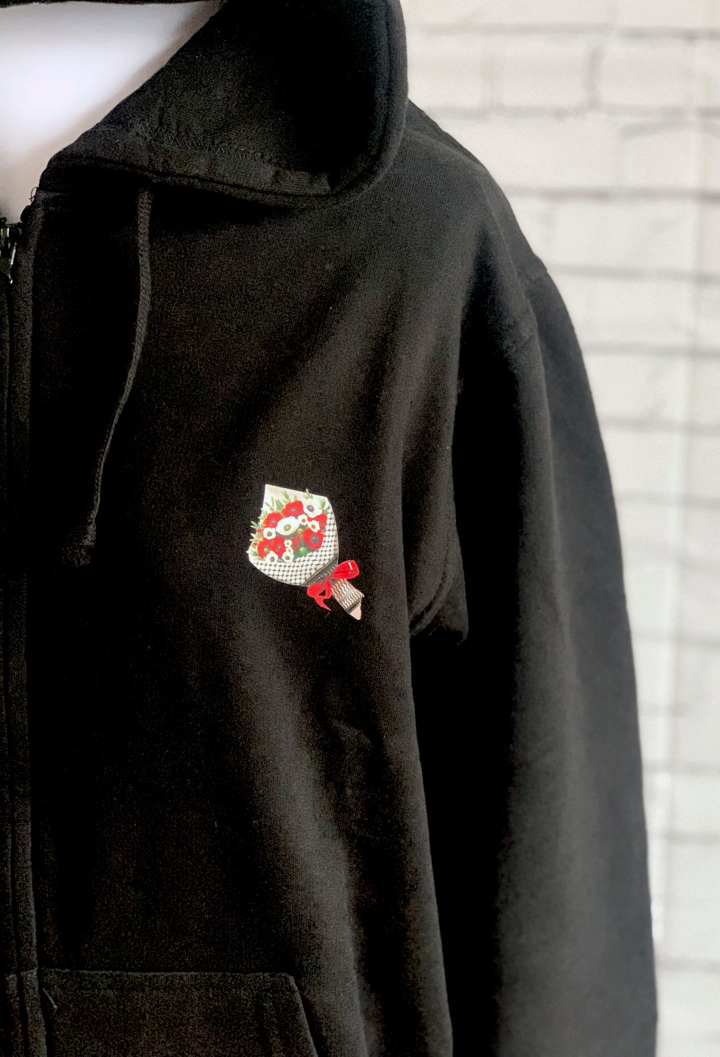 Close-up of printed design on unisex zip-up hoodie


